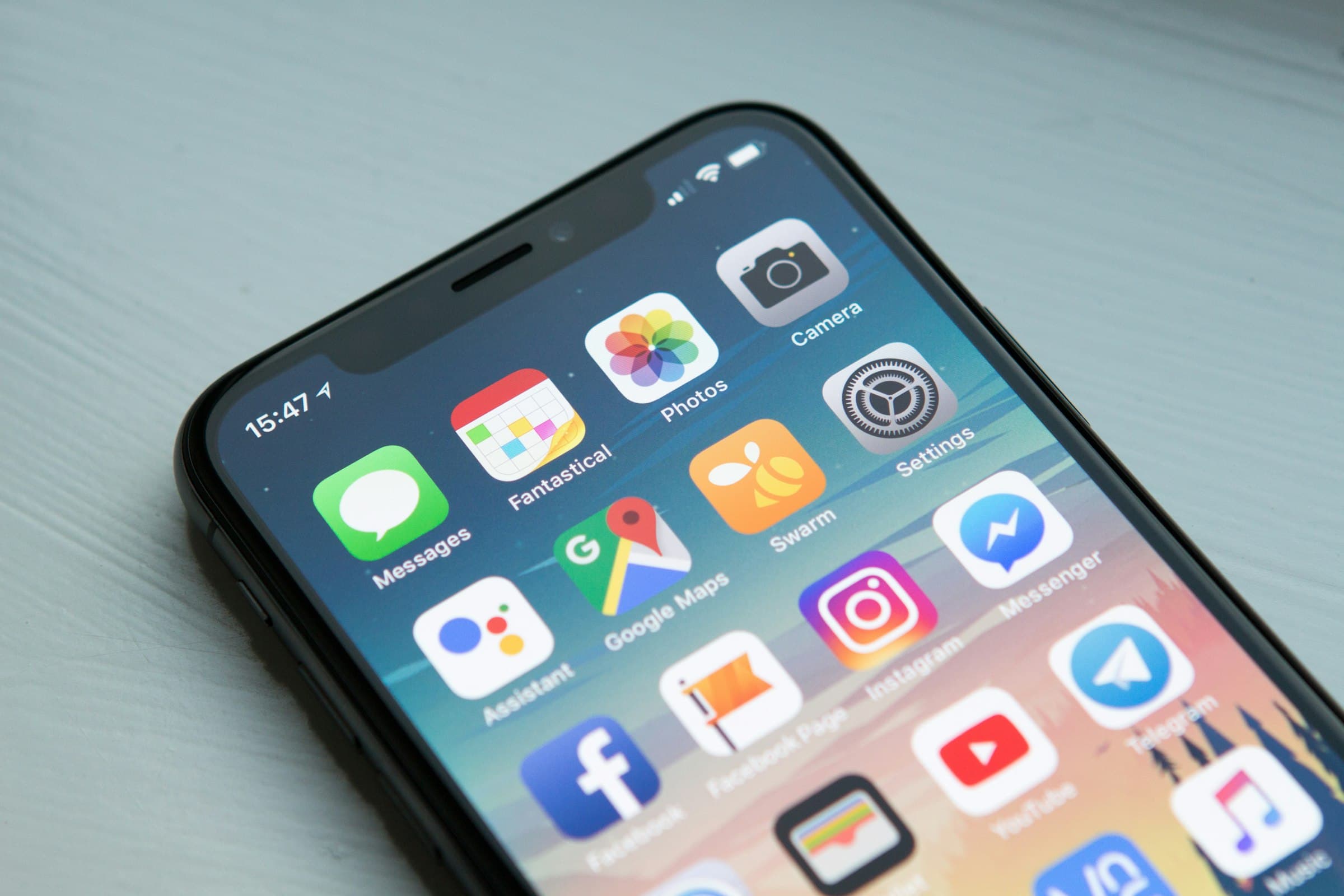 Hands holding a smartphone — mobile product craft